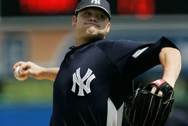 Joba Chamberlain throwing against the Tigers